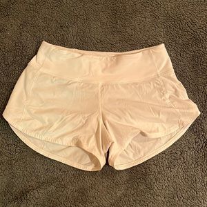 White Lululemon running shorts